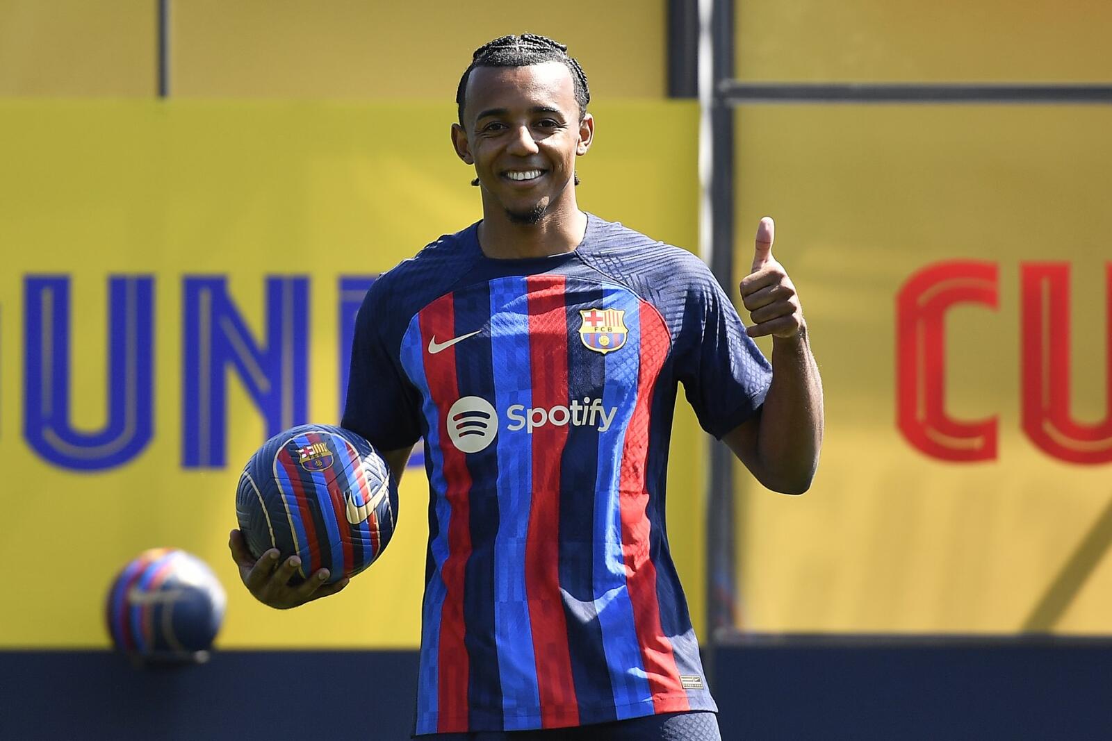 TOPSHOT - FC Barcelona's new french defender Jules Kounde poses for pictures during his presentation ceremony at the Joan Gamper training ground in Sant Joan Despi, near Barcelona, on August 1, 2022. (Photo by Pau BARRENA / AFP)