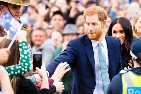 MELBOURNE, AUSTRALIA - OCTOBER 18: Prince Harry, Duke of Sussex and Meghan Markle, Duchess of Sussex meet fans at Government House in Melbourne, Australia. Shutterstock image.