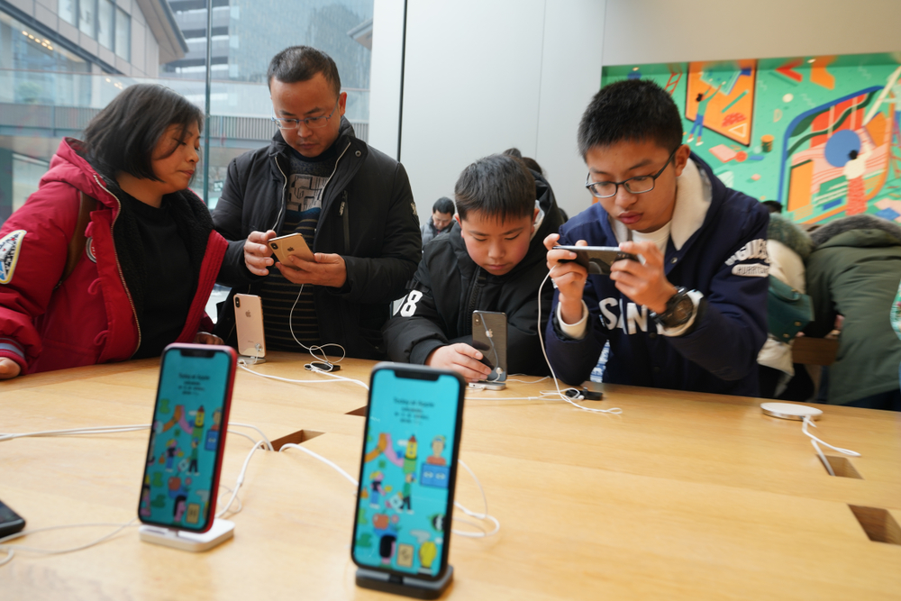 Tim Cook in China to open second largest Apple store and revive iPhone sales