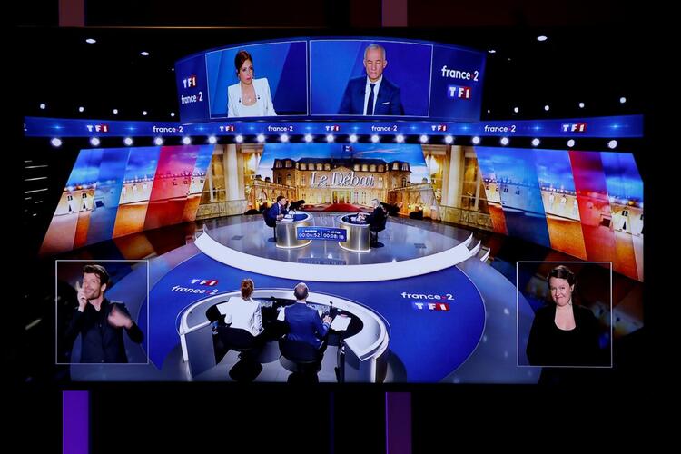 Macron Warns Le Pen She Risks ‘Civil War’ by Banning Hijab