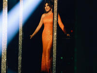 She chose a one-shouldered orange dress by Alexandre Vauthier