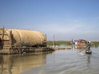 This picture taken on March 29, 2019 shows a floating palm reed-woven house for tourists in the marshes of the southern Iraqi district of Chibayish in Dhi Qar province, about 120 kilometres northwest of the southern city of Basra. Hussein FALEH / AFP