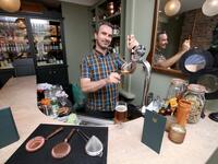 Pub co-owner Oisin Davis poses at the Virgin Mary pub, which opened recently selling non-alcoholic drinks and is known as the 'pub with no beer', in the city centre of Dublin on May 16, 2019. PAUL FAITH / AFP