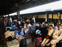 Pakistanis wait for the train to travel back home to be with their families ahead of the Muslim festival of Eid al-Fitr, in Karachi on June 2, 2019. RIZWAN TABASSUM / AFP
