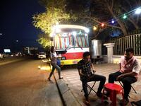 Kani Jalil, a 22-year-old Iraqi Kurdish woman who runs with her husband "The Bus Cafe Erbil" in Arbil, the capital of Iraq's Kurdish autonomous region, serves drinks to two clients seated outside her bus late on June 7, 2019, on the long weekend of the Eid al-Fitr holiday which marks the end of the holy fasting month of Ramadan.  SAFIN HAMED / AFP