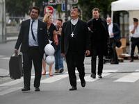 Archbishop of Paris Michel Aupetit (C) arrives to hold the first mass of the Notre-Dame de Paris cathedral two months after the fire, on June 15, 2019 in Paris. The Notre-Dame cathedral in Paris will host its first mass on June 15, 2019. Zakaria ABDELKAFI / AFP