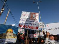 Protesters march with signs showing the Dome of the Rock and reading in  Arabic (L to R) "Jerusalem is not for sale" and "do not give up rights" during t he "March of Anger" leading to the US Embassy in the Jordanian capital Amman on June 21, 2019. Khalil MAZRAAWI / AFP