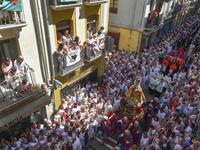 People look at the procession of Pamplona´s patron Saint Fermin on the first day of the San Fermin bullrun festival in Pamplona, northern Spain on July 7, 2019. ANDER GILLENEA / AFP