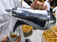 An Emirati man pours coffee during the annual Liwa Date Festival in the western region of Liwa on July 17, 2019. Karim SAHIB / AFP