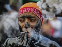 A catholic faithful smeared in burnt oil, takes part in the opening of the ten-day celebration of the Santo Domingo de Guzman festival in Managua, on August 1, 2019.  INTI OCON / AFP
