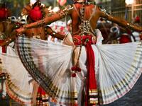 In this photograph taken on August 14, 2019 dancers perform during the "Esala Perahera" festival near the Buddhist temple of the Tooth in the ancient hill capital of Kandy, some 116 kilometres from Colombo. Lakruwan WANNIARACHCHI / AFP