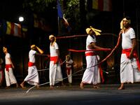 In this photograph taken on August 14, 2019 dancers perform during the "Esala Perahera" festival near the Buddhist temple of the Tooth in the ancient hill capital of Kandy, some 116 kilometres from Colombo. LAKRUWAN WANNIARACHCHI / AFP