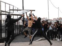 Photojournalist take pictures as three protesters tear down a barricade during demonstration in the city of Bayonne, south-west France on August 24, 2019, on the sidelines of the annual G7 Summit. Thomas SAMSON / AFP