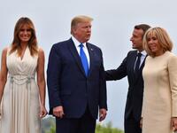 French President Emmanuel Macron (2ndR) and his wife Brigitte Macron (R) pose with US President Donald Trump (2ndL) and US First Lady Melania Trump at the Biarritz lighthouse, southwestern France, ahead of a working dinner on August 24, 2019. Nicholas Kamm / AFP