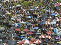 Rohingya refugees attend a ceremony organised to remember the second anniversary of a military crackdown that prompted a massive exodus of people from Myanmar to Bangladesh, at the Kutupalong refugee camp in Ukhia on August 25, 2019. MUNIR UZ ZAMAN / AFP