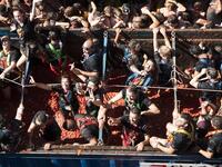 Revellers covered in tomato pulp take part in the annual "Tomatina" festival in the eastern town of Bunol, on August 28, 2019. JAIME REINA / AFP