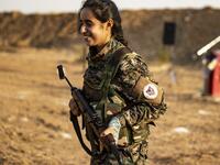 Members of the Bethnahrin Women Protection Forces (HSNB), an all-female Syriac-Assyrian paramilitary group under the umbrella of the Syrian Democratic Forces (SDF), march in line as they commemorate the fourth anniversary of their creation, in the countryside of the town of Tall Tamr in the northwestern Syrian province of Hasakah, on August 30, 2019.  Delil SOULEIMAN / AFP