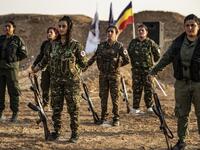 Members of the Bethnahrin Women Protection Forces (HSNB), an all-female Syriac-Assyrian paramilitary group under the umbrella of the Syrian Democratic Forces (SDF), line-up as they commemorate the fourth anniversary of their creation, in the countryside of the town of Tall Tamr in the northwestern Syrian province of Hasakah, on August 30, 2019.  Delil SOULEIMAN / AFP