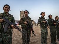 Members of the Bethnahrin Women Protection Forces (HSNB), an all-female Syriac-Assyrian paramilitary group under the umbrella of the Syrian Democratic Forces (SDF), line-up as they commemorate the fourth anniversary of their creation, in the countryside of the town of Tall Tamr in the northwestern Syrian province of Hasakah, on August 30, 2019.  Delil SOULEIMAN / AFP