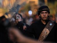 Iraqi Shiite men beat their backs with metal chains in the capital Baghdad's mostly Shiite neighbourhood of Kadhimiya marking the 8th day of Muharram, ahead of Ashura. Ahmad AL-RUBAYE / AFP