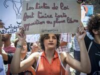 A demonstrator holds up a sign reading in French "the texts of the law silence all opposition or freedom of speech", during a protest outside a courthouse holding the trial of Hajar Raissouni, a Moroccan journalist of the daily newspaper Akhbar El-Youm, on charges of abortion, in the capital Rabat on September 9, 2019. FADEL SENNA / AFP