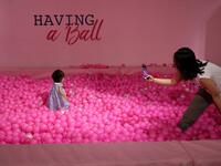 Visitors take and pose for "selfie" photographs at The Selfie Factory in Westfield London shopping centre in west London on September 11, 2019. ISABEL INFANTES / AFP