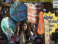 Youths hold placards as they march for a climate strike to protest against governmental inaction towards climate breakdown and environmental pollution, part of demonstrations being held worldwide in a movement dubbed "Fridays for Future", in Karachi on September 20, 2019. ASIF HASSAN / AFP