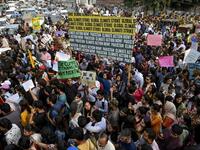 Youths hold placards as they march for a climate strike to protest against governmental inaction towards climate breakdown and environmental pollution, part of demonstrations being held worldwide in a movement dubbed "Fridays for Future", in Lahore on September 20, 2019. ARIF ALI / AFP
