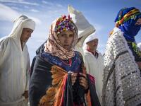 Young Amazigh (Berber) men and women take part in the the annual "Engagement Moussem" festival near the village of Imilchil in central Morocco's high Atlas Mountains on September 21, 2019. Each year in the High Atlas Mountains hamlet of Ait Amer, tribes celebrate with dance and music, the collective wedding of young Amazigh couples during the traditional festival. FADEL SENNA / AFP