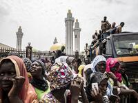 Worshippers are seen waiting outside the Great Mosque of the Mourides on September 27, 2019 in Dakar, ahead of its inauguration. Senegal's influential Mouride Brotherhood will inaugurate a 30,000-capacity mosque in the capital Dakar, said to be the largest in West Africa. JOHN WESSELS / AFP