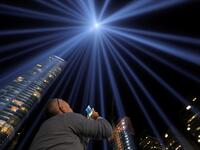 People look toward the Tribute in Light, lit up to commemorate the 18th anniversary of the September 11, 2001 attacks in New York, on Tuesday (Twitter)