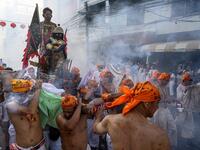 The festival begins on the first evening of the ninth lunar month and lasts for nine days, with many religious devotees slashing themselves with swords, piercing their cheeks with sharp objects and committing other painful acts to purify themselves, taking on the sins of the community. Mladen ANTONOV / AFP