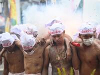 The festival begins on the first evening of the ninth lunar month and lasts for nine days, with many religious devotees slashing themselves with swords, piercing their cheeks with sharp objects and committing other painful acts to purify themselves, taking on the sins of the community. Mladen ANTONOV / AFP