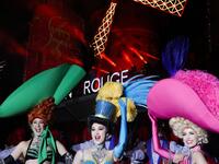 Moulin Rouge dancers pose during the celebration of the 130th anniversary of the French oldest cabaret, on October 6, 2019 in Paris.  GEOFFROY VAN DER HASSELT / AFP
