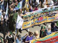 Syrian Kurds take part in a demonstration against Turkish threats in Ras al-Ain town in Syria's Hasakeh province near the Turkish border on October 9, 2019. Syrian Kurds called on Damascus ally Moscow to facilitate "dialogue" with the regime, following threats of a Turkish invasion of northeastern Syria. Delil SOULEIMAN / AFP