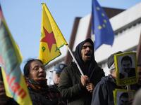 Kurdish demonstrators wave flags and hold portraits of Kurdish leader Abdullah Ocalan in front of the Council of Europe in Strasbourg, northeastern France, during a demonstration to protest against Turkey's military action in northern Syria on October 9, 2019. FREDERICK FLORIN / AFP