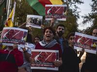 Kurds living in Athens hold banners as they protest near the Turkish embassy in Athens, on October 9, 2019. Turkey launched an assault on Kurdish forces in northern Syria with air strikes and explosions reported along the border. President Recep Tayyip Erdogan announced the start of the attack on Twitter, labelling it "Operation Peace Spring". Louisa GOULIAMAKI / AFP