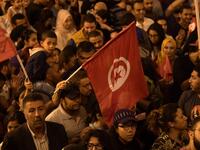 Tunisians gather to celebrate the victory of Kais Saied in the Tunisia's presidential runoff on October 13, 2019, in the capital Tunis. Conservative academic Kais Saied, a political outsider, won a landslide victory Sunday in Tunisia's presidential runoff, sweeping aside his rival, media magnate Nabil Karoui, state television said. Fethi Belaid / AFP
