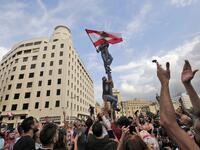 Lebanese demonstrators gather during a mass protest in the centre of the capital Beirut on October 18, 2019 against dire economic conditions. Public anger has simmered since parliament passed an austerity budget in July to help trim a ballooning deficit and flared on October 17 over new plans to tax calls on messaging applications such as WhatsApp, forcing the government to axe the unpopular proposal. ANWAR AMRO / AFP