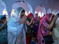 Sikh pilgrims pray at a shrine in Nankana Sahib, some 75 kms west of Lahore on November 7, 2019, on the occasion of the 550th birth anniversary of Guru Nanak Dev. A corridor that will allow Sikhs to cross from India into Pakistan to visit one of the religion's holiest sites is set to open on November 9, with thousands expected to make a pilgrimage interrupted by decades of conflict. Arif ALI / AFP