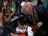 Palestinian relatives of Islamic Jihad militant Abdullah al-Belbasi mourn during his funeral in Beit Hanun in the northern Gaza Strip on November 13, 2019. Two more Palestinians were killed in an Israeli strike in the Gaza Strip, the enclave's health ministry said, as Israel said it was targeting rocket-launching squads and militant sites. The deaths brought the Gaza toll to 18 people killed since an exchange of fire began on Tuesday with an Israeli targeted strike on an Islamic Jihad commander sparking ret