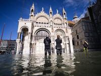 A general view shows the flooded St. Mark's Square, with St. Mark's Basilica (C) on November 14, 2019 in Venice. Much of Venice was left under water after the highest tide in 50 years ripped through the historic Italian city, beaching gondolas, trashing hotels and sending tourists fleeing through rapidly rising waters. Filippo MONTEFORTE / AFP