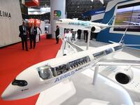 Models of an Airbus 350 and Airbus 330 are displayed during the Dubai Airshow in Dubai on November 19, 2019. Emirates Airline said it will buy 50 Airbus 350-900 aircraft in a deal worth $16 billion, with delivery to begin from May 2023. KARIM SAHIB / AFP