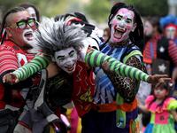 A group of clowns play during the International Clown Day in Guadalajara, Mexico, on December 10, 2019. Ulises Ruiz / AFP