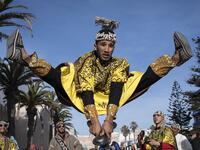 A Gnawa traditional group performs in the city of Essaouira on December 14, 2019, to celebrate the decision of adding the Gnawa culture to UNESCO's list of Intangible Cultural Heritage of Humanity. FADEL SENNA / AFP