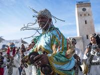 A Gnawa traditional group performs in the city of Essaouira on December 14, 2019, to celebrate the decision of adding the Gnawa culture to UNESCO's list of Intangible Cultural Heritage of Humanity. FADEL SENNA / AFP
