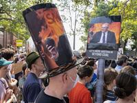 Demonstrators attend a climate protest in Sydney on December 19, 2019. Protesters marched on Australian Prime Minister Scott Morrison's official residence in Sydney to demand curbs on greenhouse gas emissions and highlight his absence on an overseas holiday as bushfires burned across the region. Wendell TEODORO / AFP