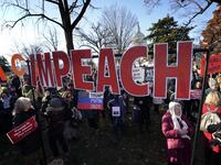 Protesters supporting the impeachment of U.S. President Donald Trump gather outside the U.S. Capitol December 18, 2019 in Washington, DC. Later today the U.S. House of Representatives is expected to vote on two articles of impeachment against Trump charging him with abuse of power and obstruction of Congress. Win McNamee/Getty Images/AFP