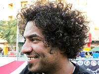 An Iraqi anti-government protestor poses with a distinct hairstyle at Tahrir Square in central Baghdad on December 23, 2019. Since the start of Iraq's anti-government protests on October 1, one thing strikes the eye perhaps above all else -- the unbridled hairstyles young men sport. High quiffs, tight fades and loads of attitude -- it is quite the male beauty pageant. SABAH ARAR / AFP