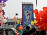 Vendors selling balloons wait for customers on the occasion of the New Year celebrations outside the Methodist Church Maninagar in Ahmedabad on January 1, 2020. SAM PANTHAKY / AFP